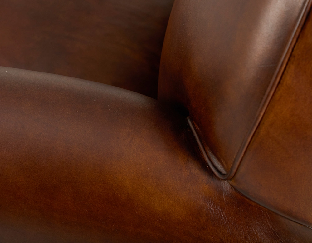 Leather club armchair vintage brown piped armrests Leather club armchair vintage brown piped armrests