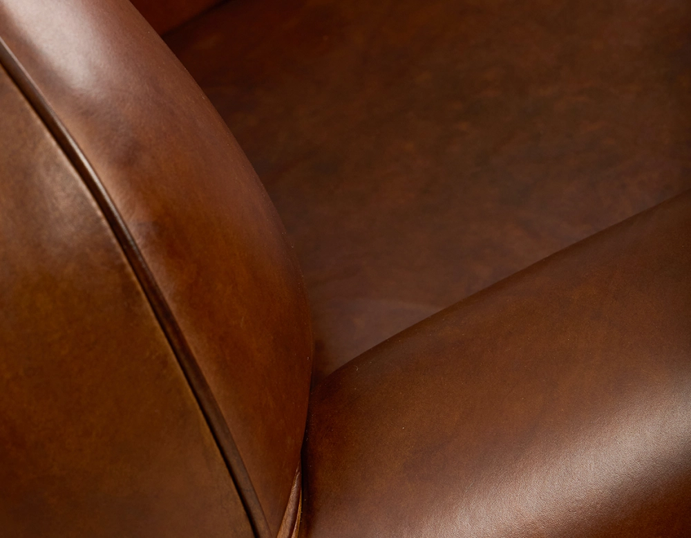 Leather club armchair vintage brown piped armrests Leather club armchair vintage brown piped armrests
