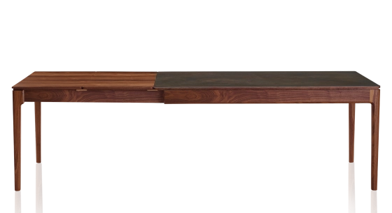 Extending table for 8 to 12 people in walnut and ceramic with wooden extensions with natural stained wood and oxidised brown ceramic top 210x90 cm