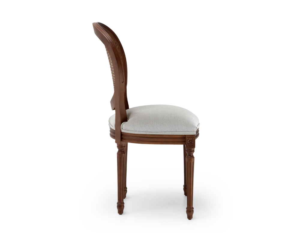 Louis XVI style antique chair dark brown stained wood with cane backrest and light grey fabric seat. Louis XVI style antique chair dark brown stained wood with cane backrest and light grey fabric seat.