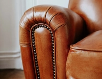 Leather club armchair light brown studded armrests Leather club armchair light brown studded armrests