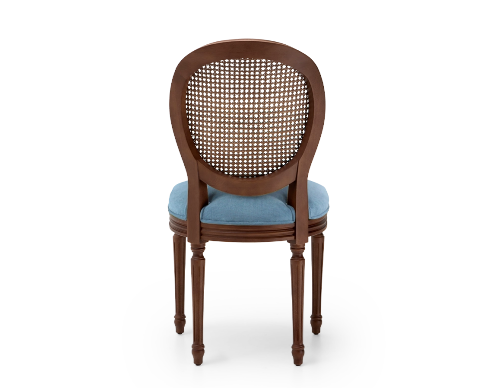 Louis XVI style antique chair dark brown stained wood with cane backrest and denim blue fabric seat. Louis XVI style antique chair dark brown stained wood with cane backrest and denim blue fabric seat.