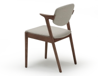 Walnut coloured design chair and natural beige fabric Walnut coloured design chair and natural beige fabric