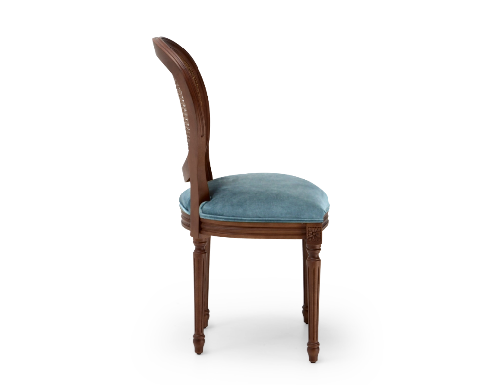 Louis XVI style antique chair dark brown stained wood with cane backrest and petrol blue velvet seat. Louis XVI style antique chair dark brown stained wood with cane backrest and petrol blue velvet seat.