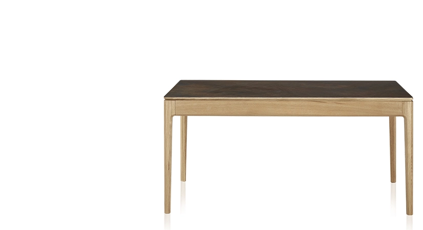 Extendable table for 8 to 12 people in oak and ceramic with wooden extensions with natural stained wood and oxidised brown ceramic top 180x100 cm Extendable table for 8 to 12 people in oak and ceramic with wooden extensions with natural stained wood and oxidised brown ceramic top 180x100 cm