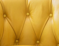 Chesterfield leather armchair yellow studded armrests Chesterfield leather armchair yellow studded armrests