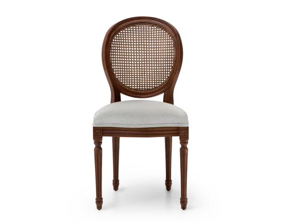 Louis XVI style antique chair dark brown stained wood with cane backrest and light grey fabric seat.