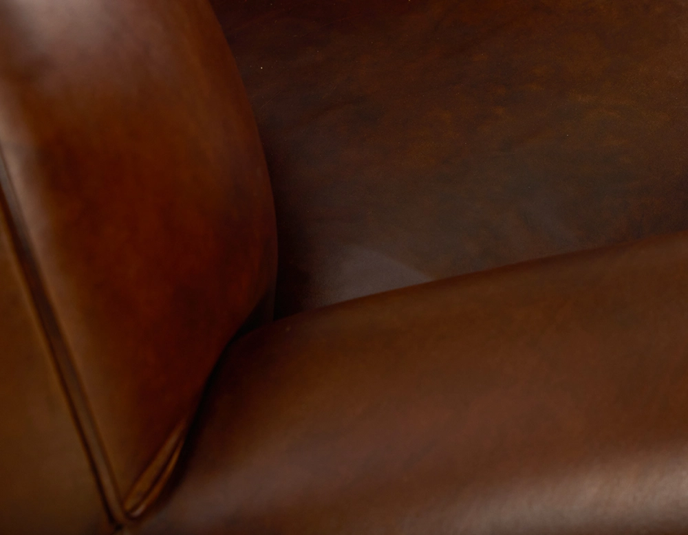 Leather club armchair vintage brown studded armrests Leather club armchair vintage brown studded armrests