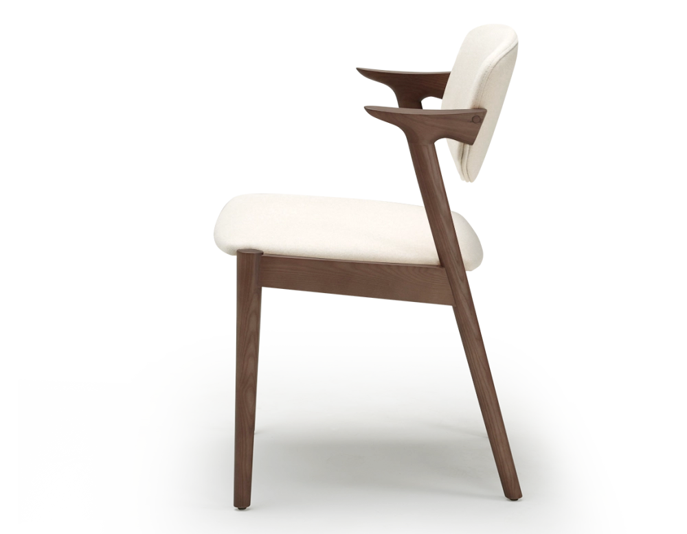 Scandinavian chair walnut-stained wood with off-white fabric seat. Scandinavian chair walnut-stained wood with off-white fabric seat.