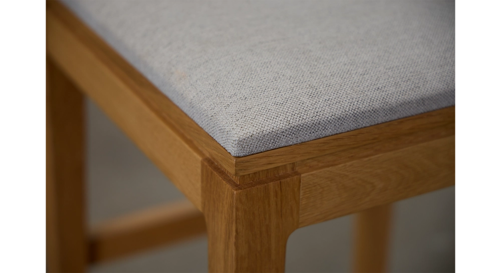 Design bar stool H65 cm natural wood finish with beige fabric seat Design bar stool H65 cm natural wood finish with beige fabric seat