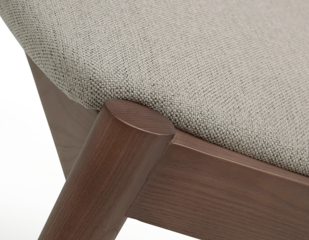 Walnut coloured design chair and natural beige fabric Walnut coloured design chair and natural beige fabric
