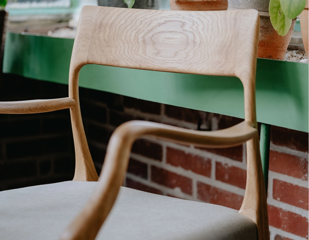 Scandinavian armchair with armrests natural wood stain camel fabric seat Scandinavian armchair with armrests natural wood stain camel fabric seat