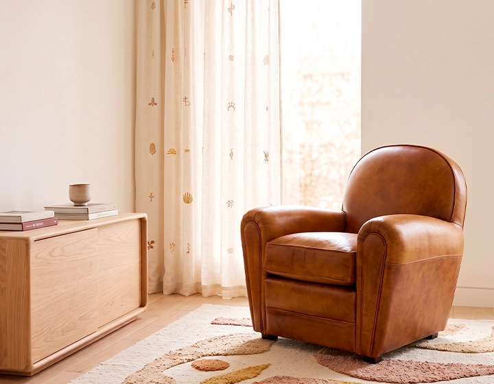 Fauteuil club cuir cognac accoudoirs passepoil