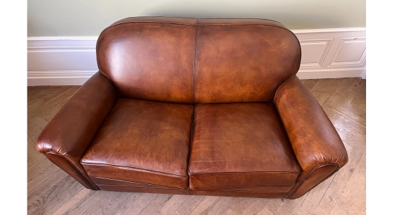 2-seater leather sofa club vintage brown armchair with piping on the armrests