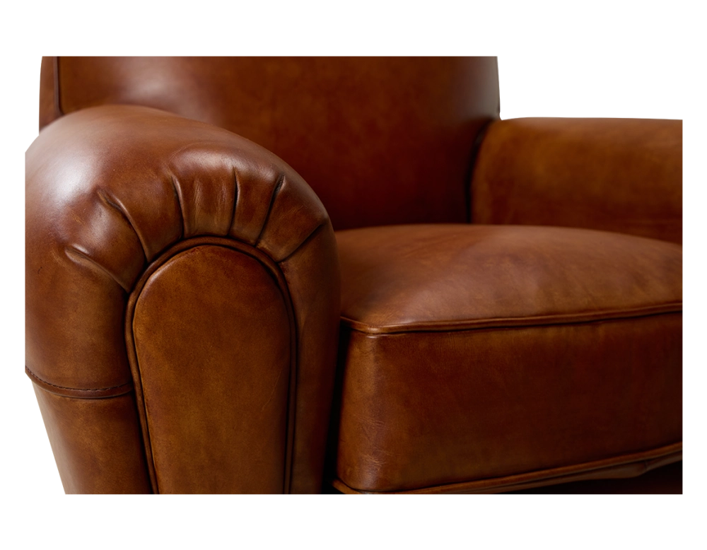 Leather club armchair light brown piped armrests Leather club armchair light brown piped armrests