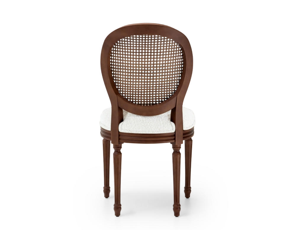 Louis XVI style antique chair dark brown stained wood with cane backrest and white bouclé fabric seat. Louis XVI style antique chair dark brown stained wood with cane backrest and white bouclé fabric seat.
