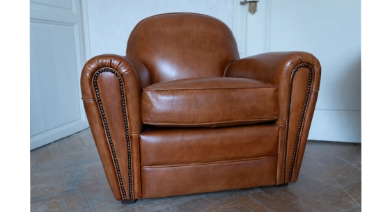 Leather club armchair light brown studded armrests