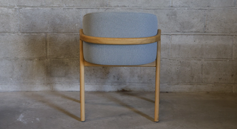 Oak chair design wood stained in xxxxx, seat upholstered in xxxxxx.