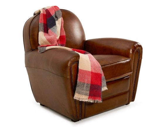 Fauteuil club cuir marron vintage accoudoirs cloutés