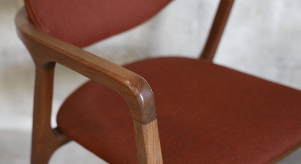 Walnut Designer armchair natural wood finish and brown fabric