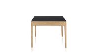 Extendable table for 8 to 12 people in oak and ceramic with ceramic extensions with natural stained wood and plain black ceramic top and extensions 160x100 cm