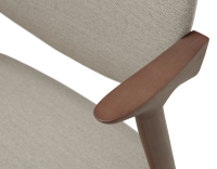 Walnut coloured design chair and natural beige fabric Walnut coloured design chair and natural beige fabric
