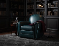 Fauteuil club cuir bleu accoudoirs cloutés