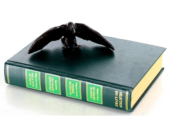 Bronze animal figure of a duck landing on water