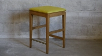 Design bar stool H65 cm natural wood finish with beige fabric seat