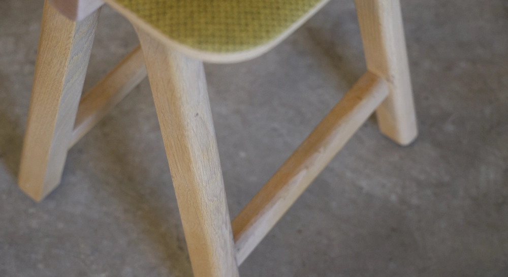 Design bar stool H65 cm natural wood finish with blue fabric seat