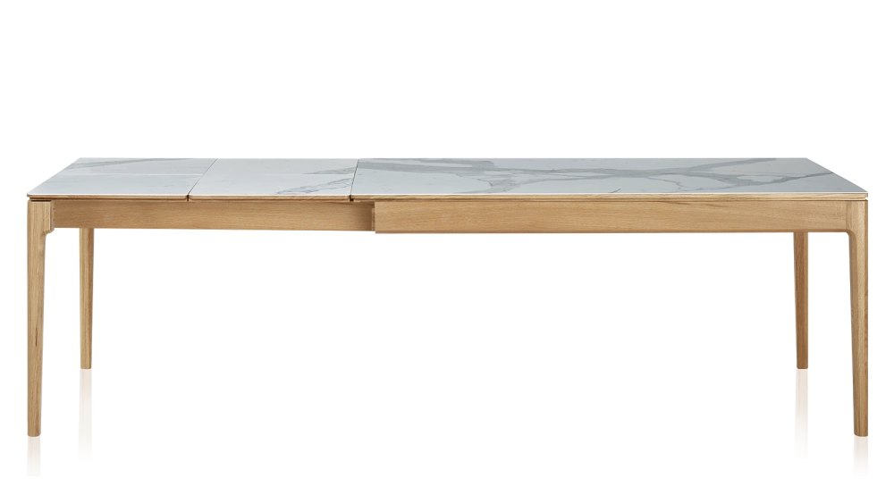 Extendable table for 8 to 12 people in oak and ceramic with ceramic extensions with natural stained wood and white marble effect ceramic top and extensions 180x100 cm
