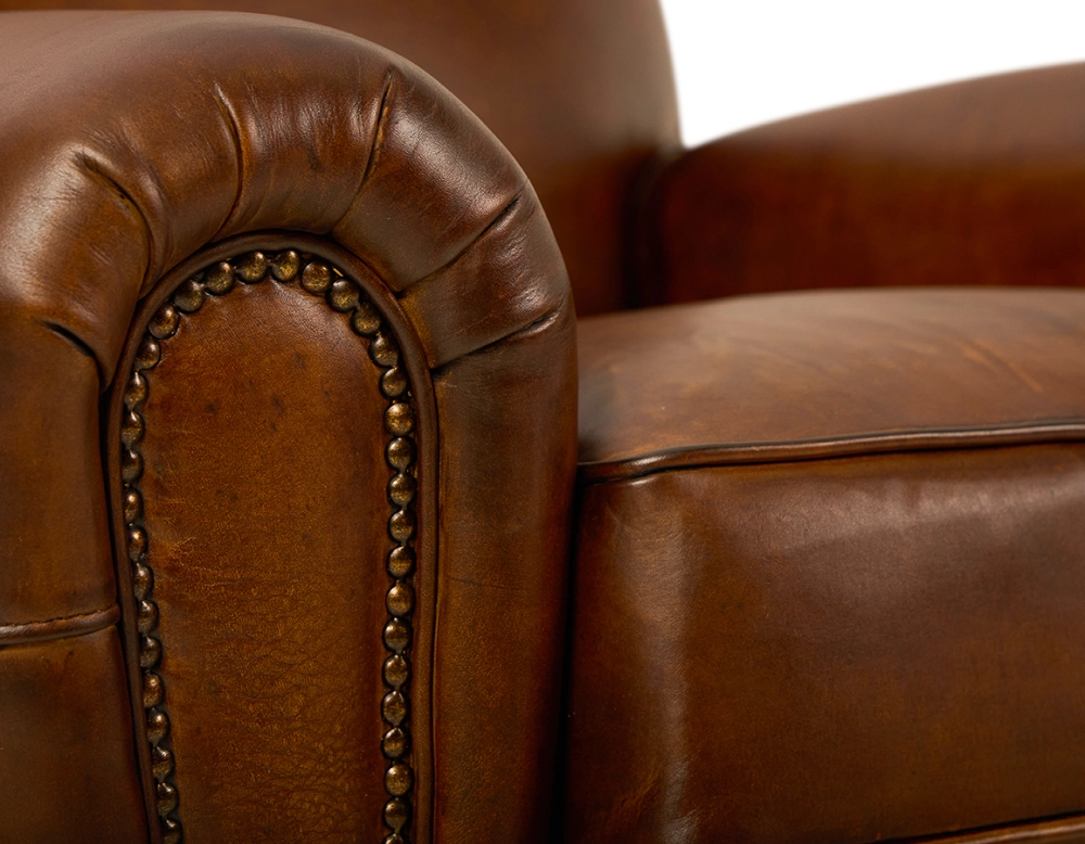Leather club armchair vintage brown studded armrests Leather club armchair vintage brown studded armrests