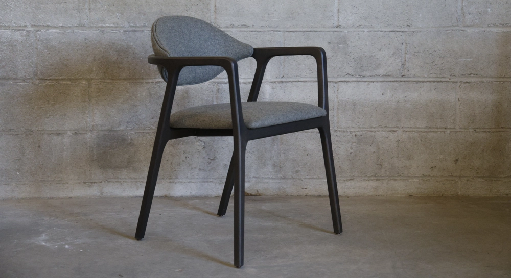 Designer armchair with ash wood armrests wood stained anthracite and grey fabric