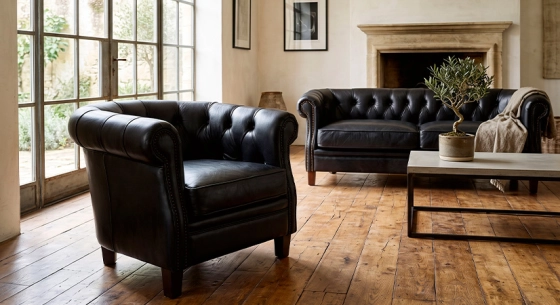 Canapé Chesterfield cuir 2 places noir accoudoirs cloutés