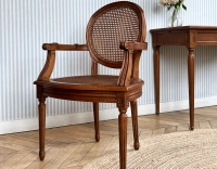 Chaise ancienne style Louis XVI avec accoudoirs bois teinte ancienne assise et dossier cannés Chaise ancienne style Louis XVI avec accoudoirs bois teinte ancienne assise et dossier cannés