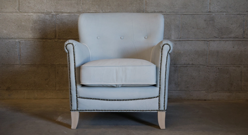 Leather club armchair dark brown studded armrests