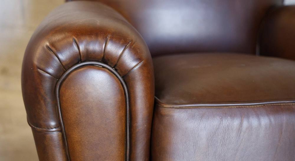 Leather club armchair dark brown studded armrests