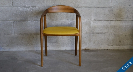 Scandinavian chair walnut wood with a pale yellow fabric seat