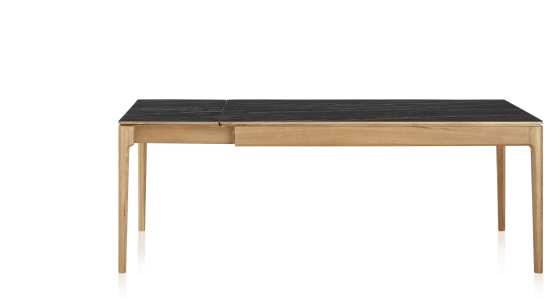 Extendable table for 8 to 12 people in oak and ceramic with ceramic extensions with natural stained wood and black marble effect ceramic top and extensions 180x100 cm