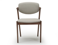 Walnut coloured design chair and natural beige fabric Walnut coloured design chair and natural beige fabric