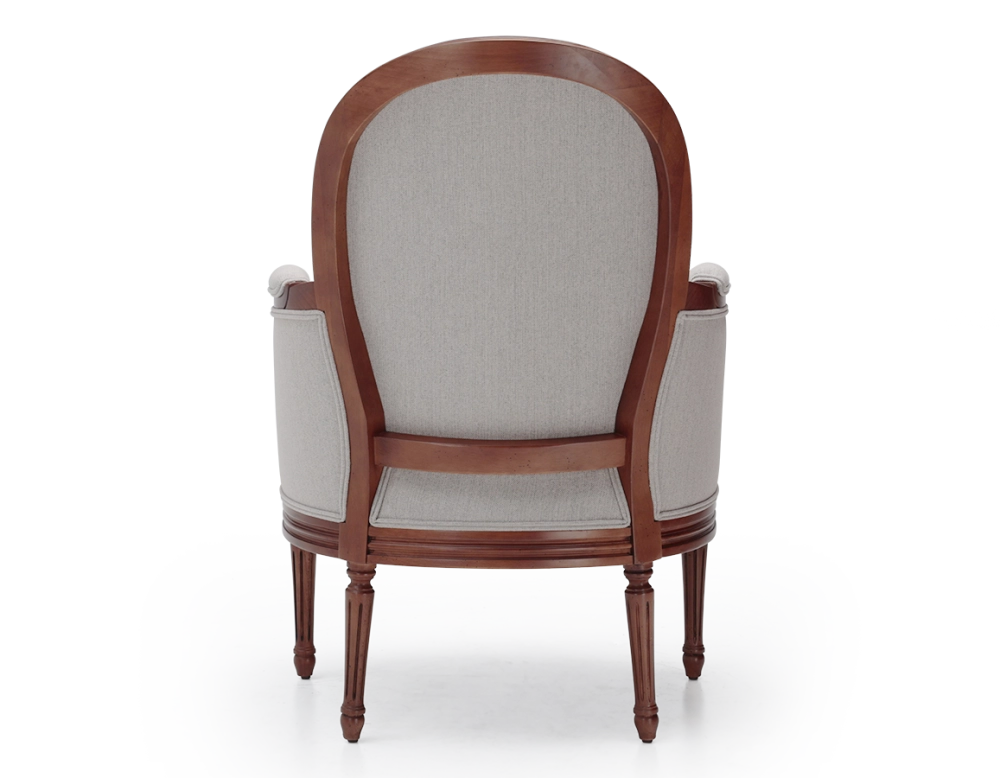 Louis XVI style moulded bergère armchair wood antique stain and natural beige fabric Louis XVI style moulded bergère armchair wood antique stain and natural beige fabric