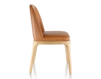 Designer chair natural stained wood and caramel leather Designer chair natural stained wood and caramel leather