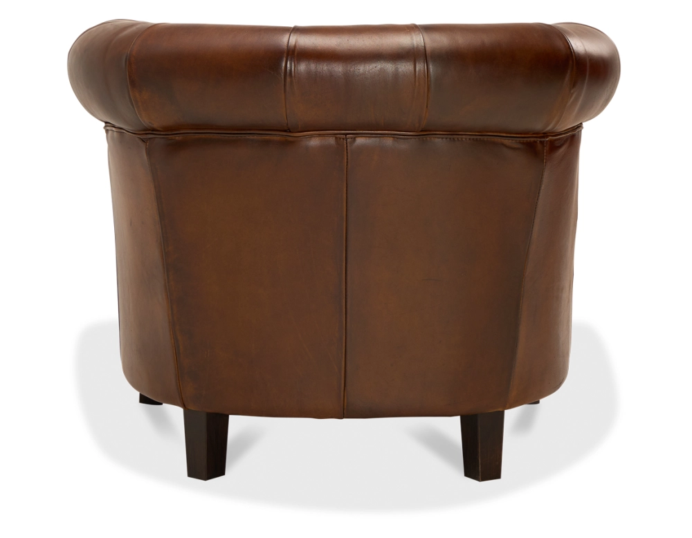 Fauteuil chesterfield cuir marron vintage accoudoirs cloutés Fauteuil chesterfield cuir marron vintage accoudoirs cloutés