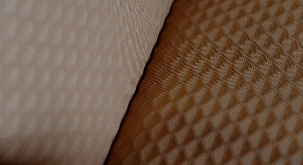 Armchair with armrests design natural walnut frame with anthracite grey fabric seat.