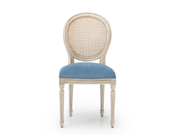Louis XVI style antique chair wood with white cerused finish, caned backrest, and blue denim seat.