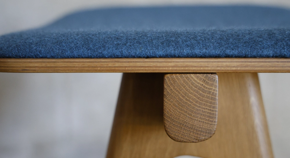 Design bar stool H65 cm natural wood finish with blue fabric seat