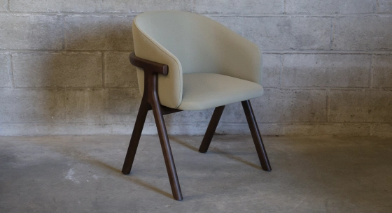 Oak chair design wood stained in xxxxx, seat upholstered in xxxxxx.