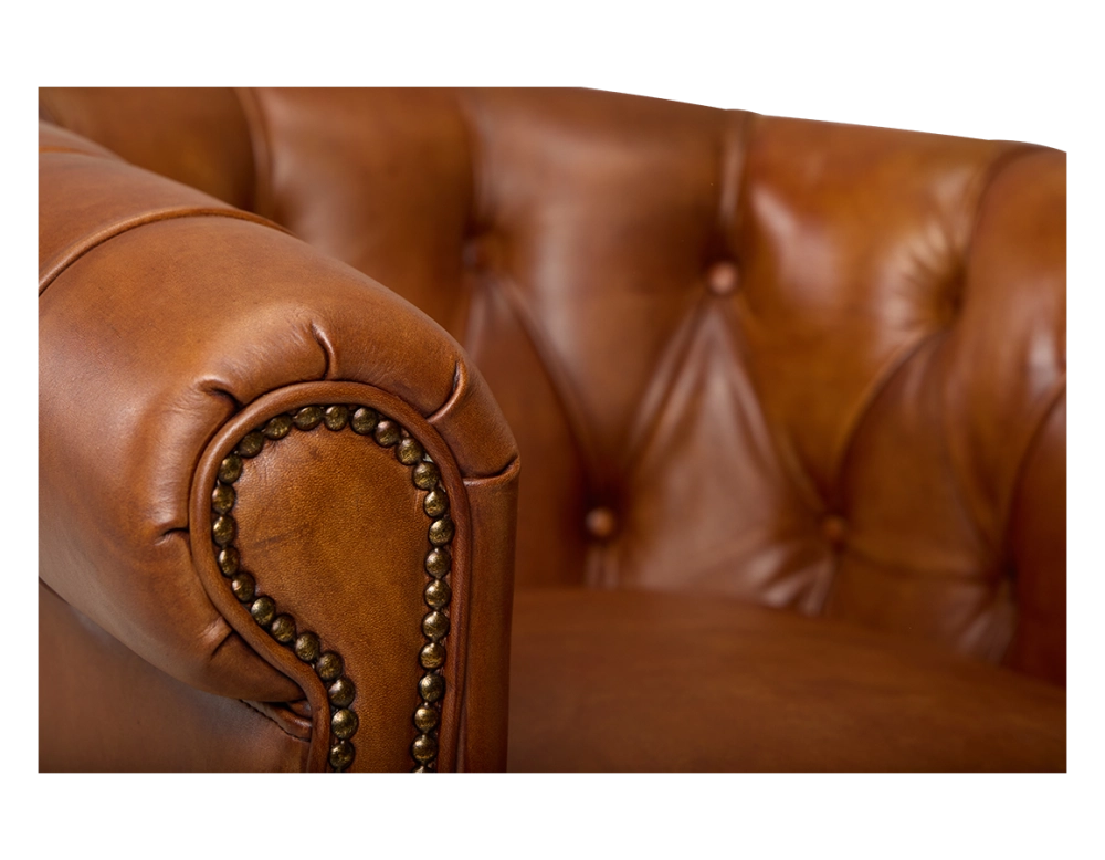 Chesterfield leather armchair light brown studded armrests Chesterfield leather armchair light brown studded armrests