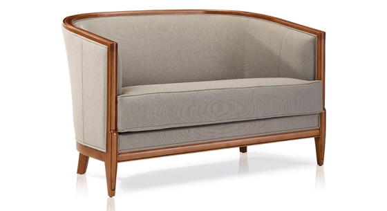 Antique 2 seater sofa with moulded armrests wood stained in an antique style and light grey fabric