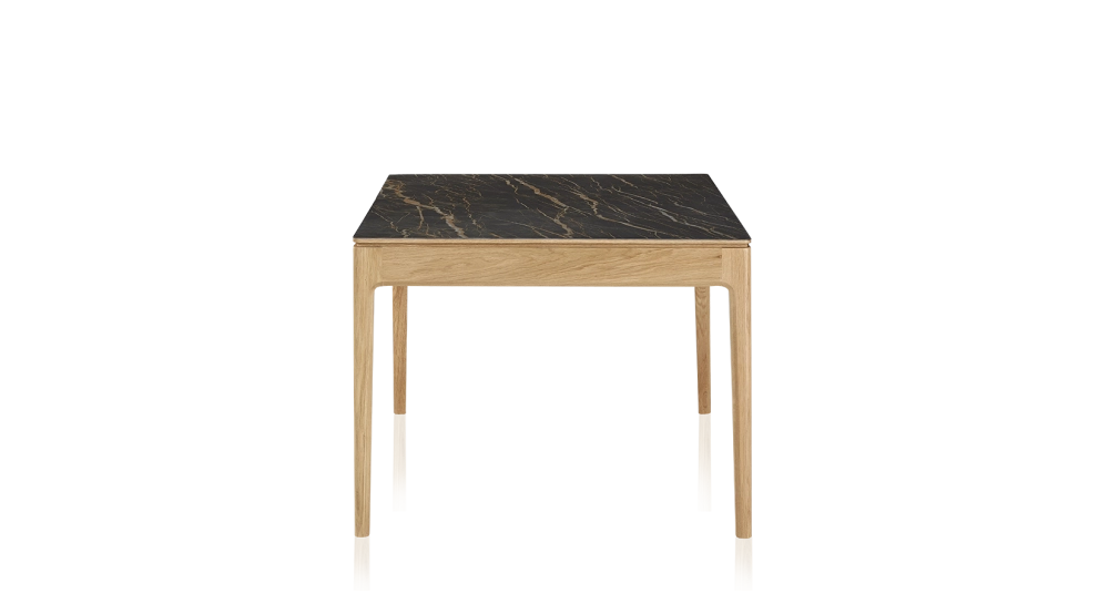 Extendable table for 8 to 12 people in oak and ceramic with ceramic extensions with natural stained wood and black marble effect ceramic top and extensions 180x100 cm